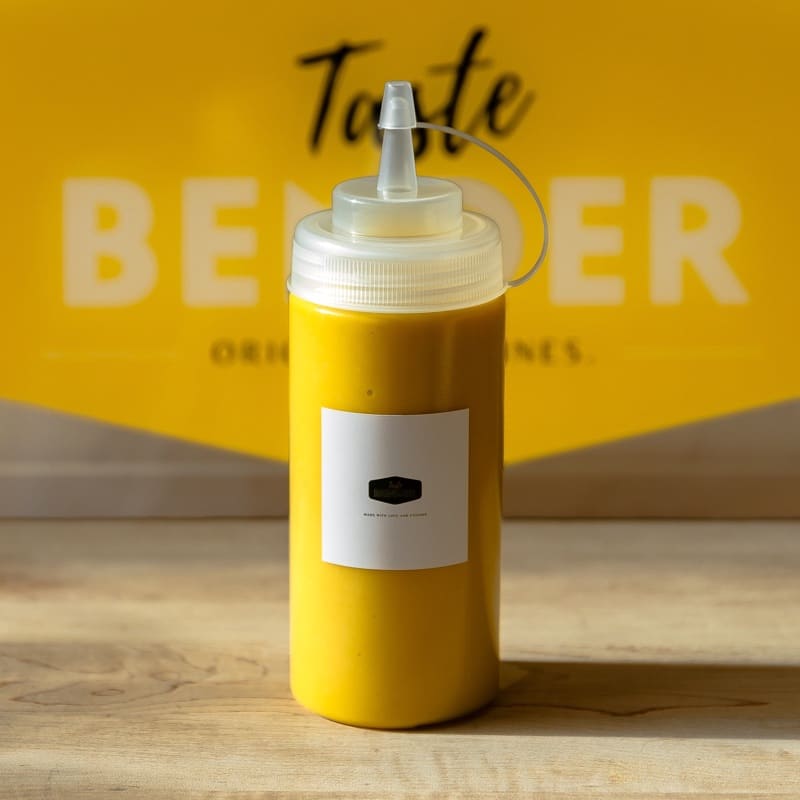 Taste Bender Signature TB Yellow Sauce in a squeeze bottle